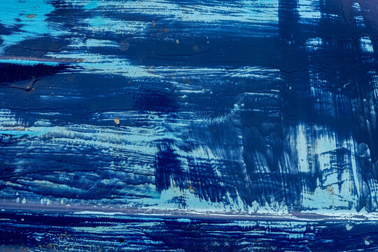 mati&egrave;re de peinture bleue sur une coque de bateau