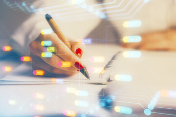 Multi exposure of woman's writing hand on background with data technology hologram. Concept of...