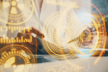 Fototapeta premium Tech theme hologram over woman's hands taking notes background. Concept of hightech. Double exposure