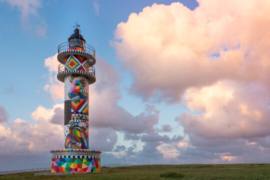 Ajo Lighthouse, Cantabria, Spain - August 28, 2020: The Ajo lighthouse has recently been colored by the internationally known Cantabrian artist Okuda San Miguel.