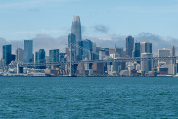Obraz premium Downtown San Francisco and Oakland Bay Bridge on sunny day