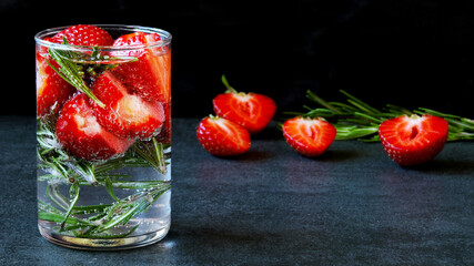 Strawberry detox drink with rosemary. Refreshing cocktail.