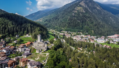 Fototapeta na wymiar St. Michael castle in Ossana stands on a rocky outcrop. Ossana castle in the village of Ossana in Val di Sole, Trentino Alto Adige, Italy. Panoramic view