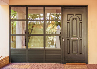 contemporary residential apartment building glass and metal frame entrance door, Athens Greece