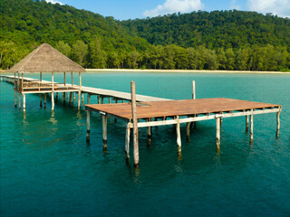 Wooden pavilions and bridges built into the sea are harbors on an island in the beautiful blue sea.