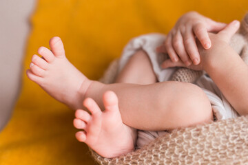 Newborn baby sleeping, on brown background.