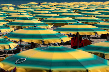 Line of yellow and green beach umbrellas