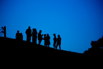 Silhouette of a group of people against the sky