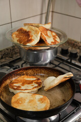 Pan-fried pastry. Baking pastry in the pan. Turkish pastry type bagel 