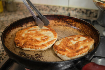 Pan-fried pastry. Baking pastry in the pan. Turkish pastry type bagel 