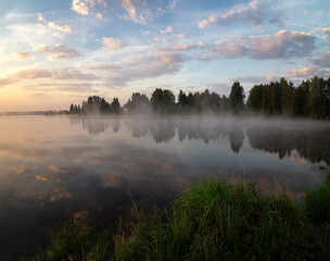 Fototapeta na wymiar morning landscape on the shore of the Ural lake with fog, Russia, Ural, August