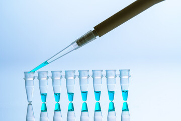  PCR Tube Strips Well  and Pipette in genetic research laboratory close up