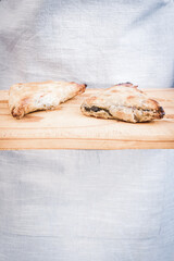 pies being served on a bread board