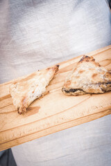 pies being served on a bread board