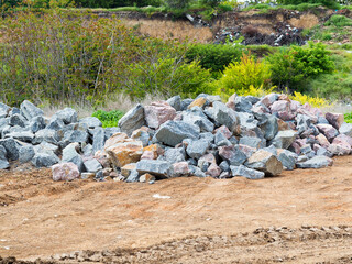 Gravel, granite stones, bout on the open construction site. Preparation for the construction of a new highway.