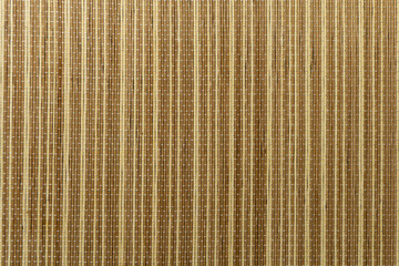 Beige bamboo napkin. Beige brown background. Sushi mat.