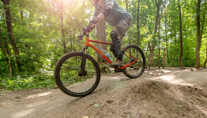 Bicycle with cyclist in sunlights