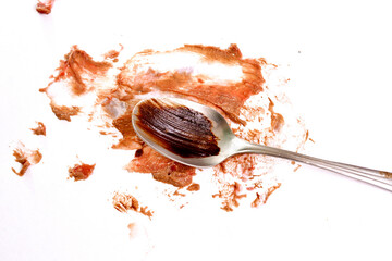 chocolate cocoa vanilla mousse on a spoon on white background