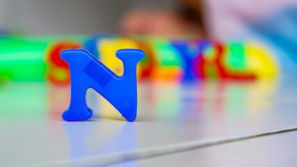 colorful letters on black background