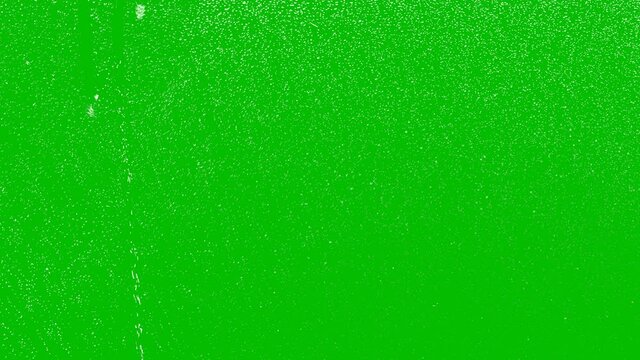 Close-Up. Realistic rain and water droplets with chroma key green screen background. Animation 