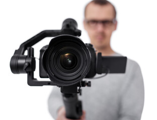close up of dslr camera on 3-axis gimbal stabilizer in videographer hands isolated on white