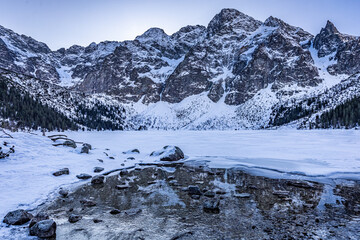 Wonderful covered by snow Morskie Oko lake in Tatra mountains