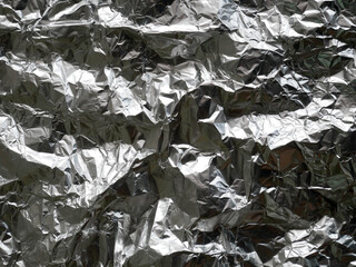 silver rough wrinkle foil texture. aluminium foil texture background. metal plate