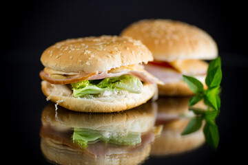 morning sandwich with bacon, cheese and herbs