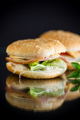 morning sandwich with bacon, cheese and herbs