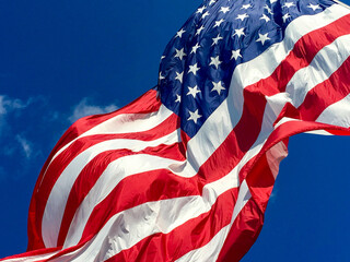 American flag on blue sky