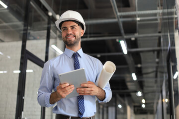 Shot of a engineer using a digital tablet on a construction site.