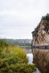 rock mass, river flows at the foot of the rocky mountains, white stone rocks, nature of Russia, southern Urals, Yuryuzan river, travel idea