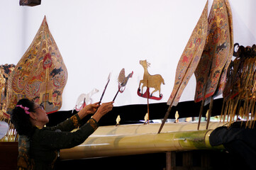 A woman puppeteer in action at Indonesian Puppet Festival in Jakarta, June 13-25 2014.