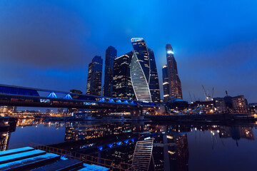 City view landscape on the towers of skyscrapers Moscow city and Bagration bridge by the river