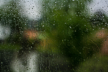 Heavy rain on the window of the car