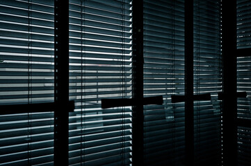 meeting room window with blinds closed