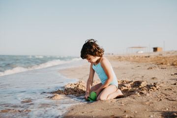happy kids playing on beach in the day time