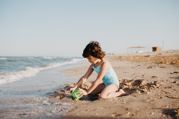 happy kids playing on beach in the day time
