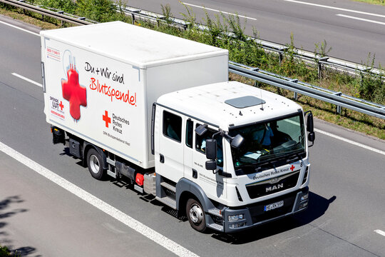 WIEHL, GERMANY - JUNE 26, 2020: German Red MAN TGL truck on motorway. The German Red Cross, or the DRK, is the national Red Cross Society in Germany.
