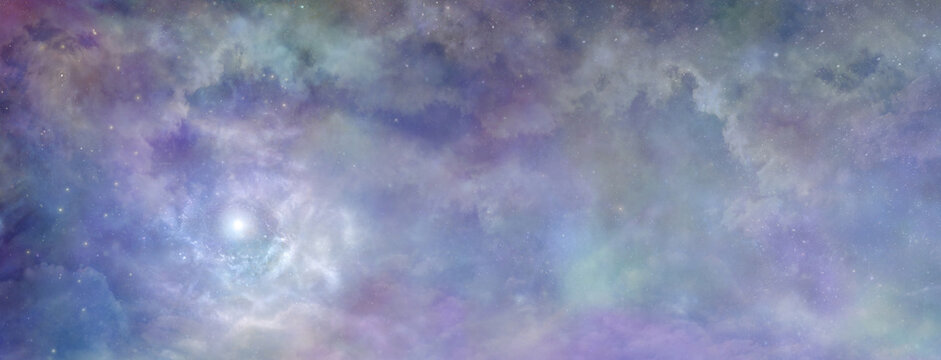 Heavenly clouds celestial  background banner - beautiful blue pink purple green lilac light filled heavenly ethereal cloudscape depicting the heavens above 
