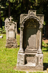 Fototapeta na wymiar ancient stone cross in cemetery