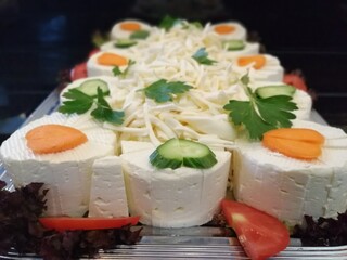 cheese plate served with various cheeses on the table