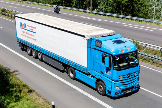 WIEHL, GERMANY - JUNE 26, 2020: KDK Mercedes-Benz Actros truck with curtainside trailer on motorway.