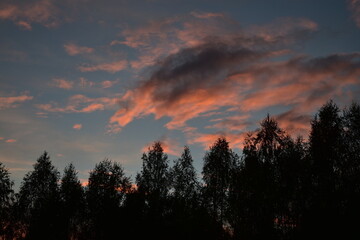 pink clouds at sunset after a thunderstorm, contrast photo