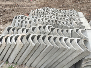 SEREMBAN, MALAYSIA -AUGUST 28, MALAYSIA: U shape precast drain at the construction site. Built of reinforced concrete. These materials are collected and stacked on top of each other before installing.