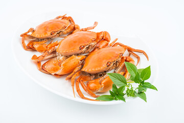 A dish of delicious steamed red sturgeon crab on white background