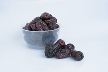 Pile of dried date palms isolated on white background