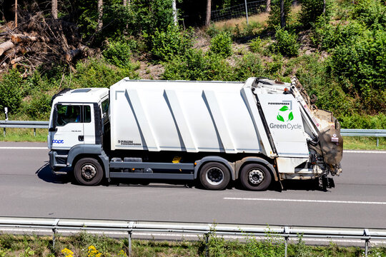 WIEHL, GERMANY - JUNE 26, 2020: GreenCycle MAN TGS dustcart on motorway. 