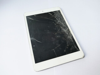 Damaged and crack screen of a tablet smartphone isolated on white background.