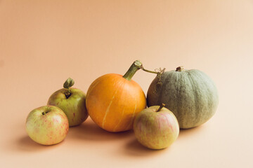 Composition of pumpkin on a beige background. The concept of thanksgiving and Halloween and autumn